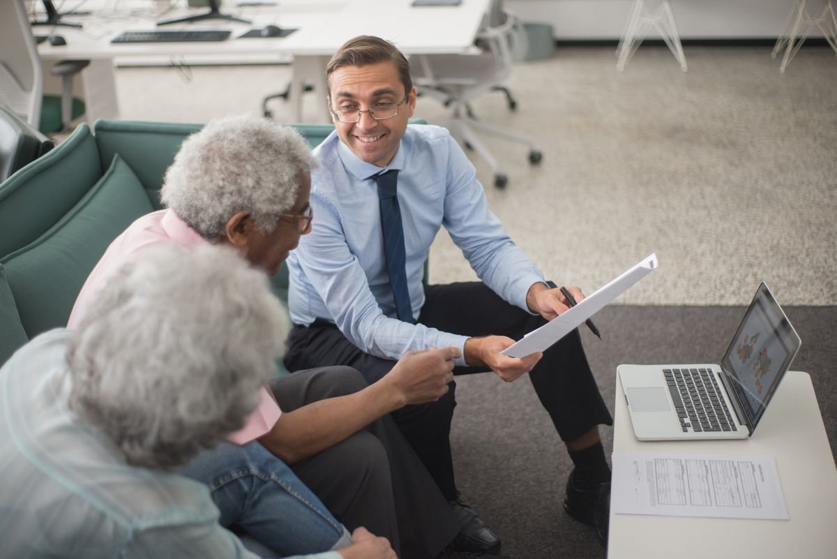 Professional financial advisor welcoming a client